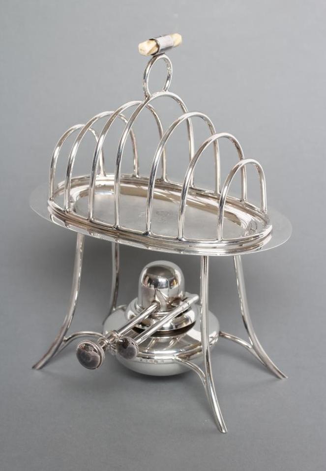 A SILVER TOASTRACK ON STAND WITH BURNER Image