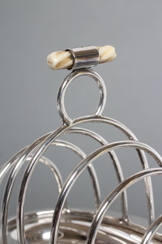 A SILVER TOASTRACK ON STAND WITH BURNER Image