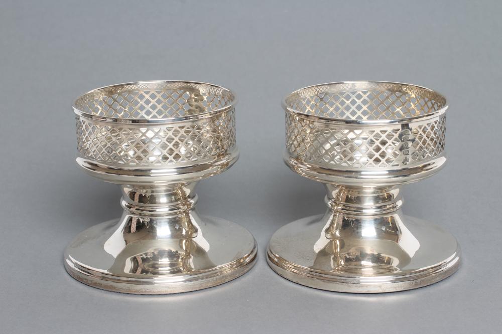 A PAIR OF SILVER CANDLE HOLDERS Image