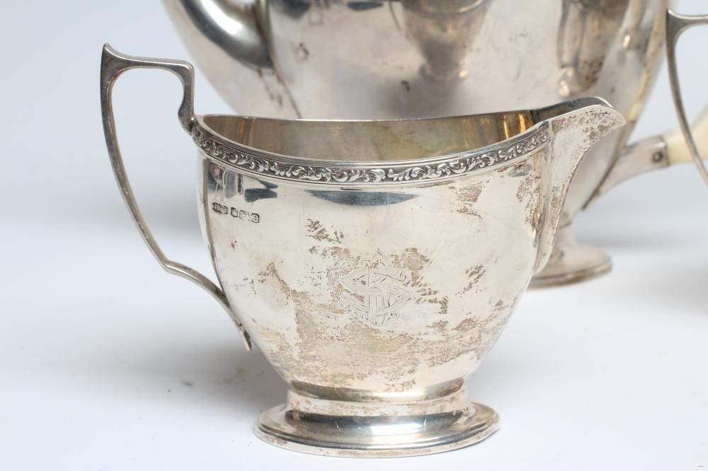 A SILVER FOUR PIECE TEA AND COFFEE SERVICE Image