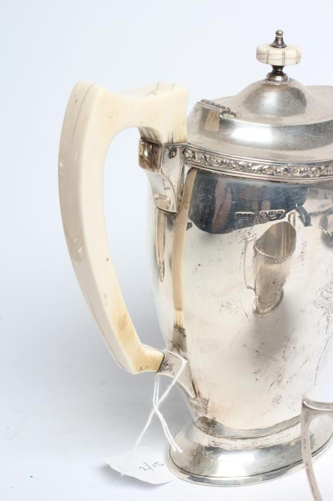 A SILVER FOUR PIECE TEA AND COFFEE SERVICE Image