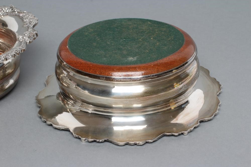 A PAIR OF GEORGIAN STYLE SILVER BOTTLE COASTERS Image