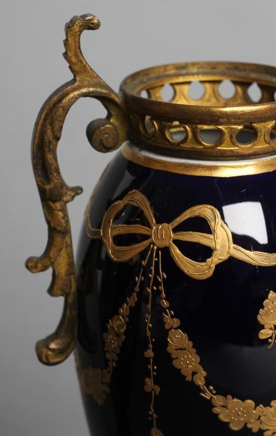 A PAIR OF FRENCH PORCELAIN GARNITURE URNS Image