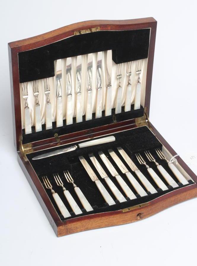 A SET OF TWELVE PAIRS OF SILVER FRUIT KNIVES AND FORKS Image
