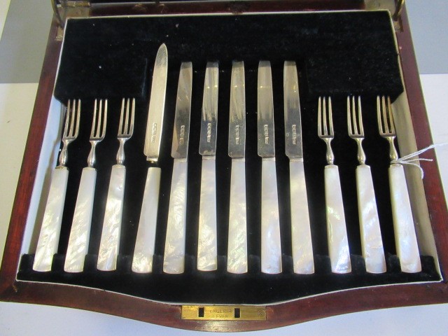 A SET OF TWELVE PAIRS OF SILVER FRUIT KNIVES AND FORKS Image