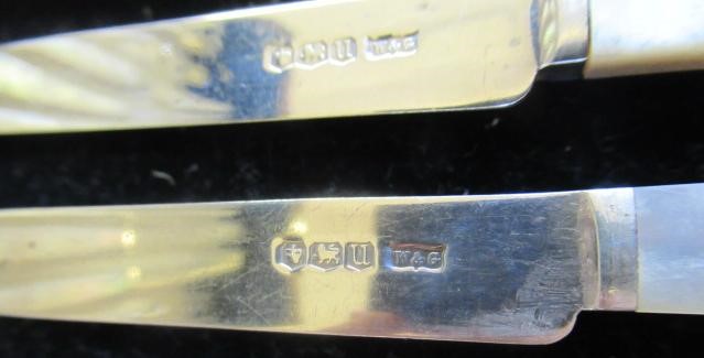 A SET OF TWELVE PAIRS OF SILVER FRUIT KNIVES AND FORKS Image