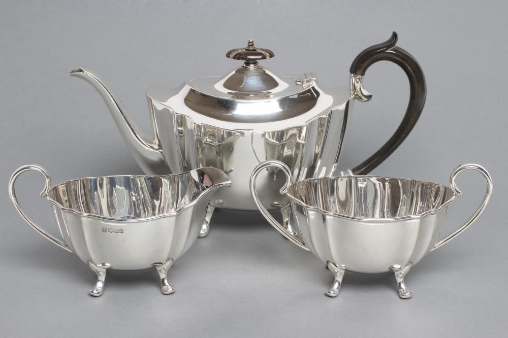 A SILVER THREE PIECE TEA SERVICE Image