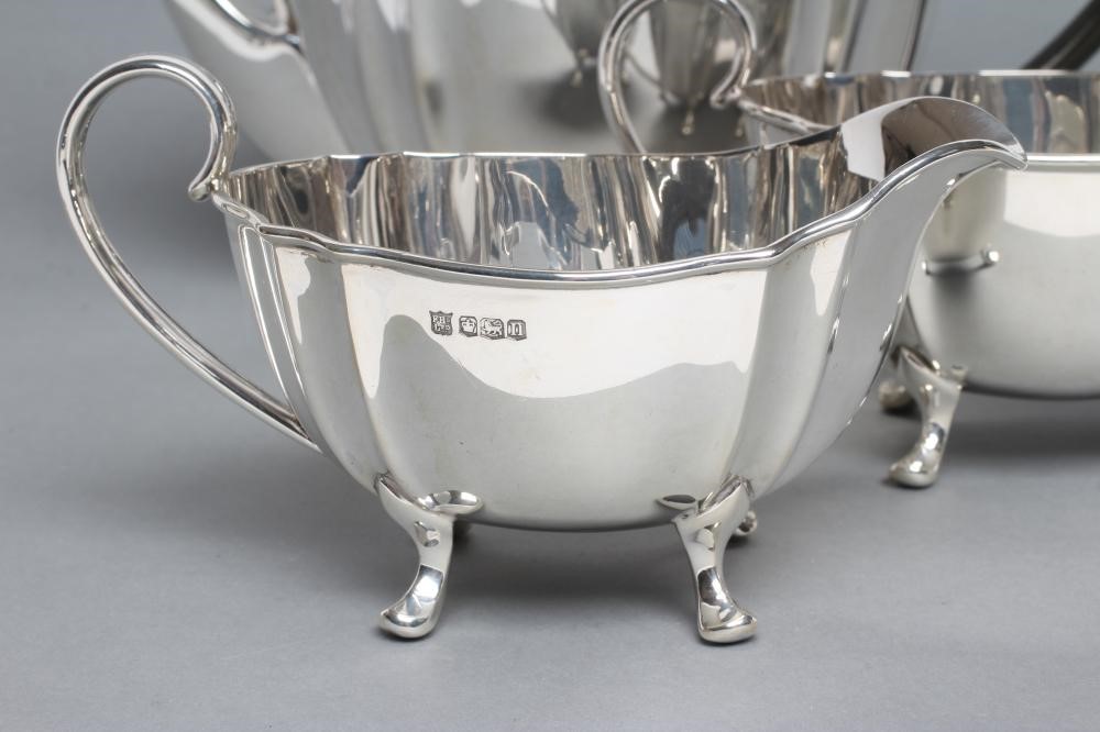 A SILVER THREE PIECE TEA SERVICE Image