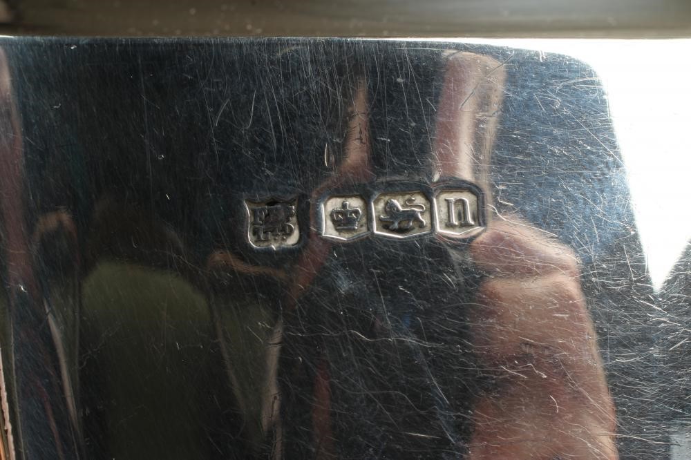 A SILVER THREE PIECE TEA SERVICE Image