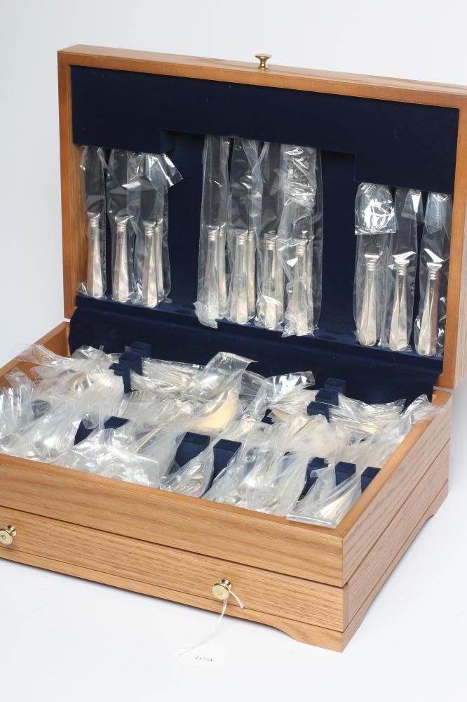 A SILVER TABLE SERVICE FOR EIGHT PLACE SETTINGS Image