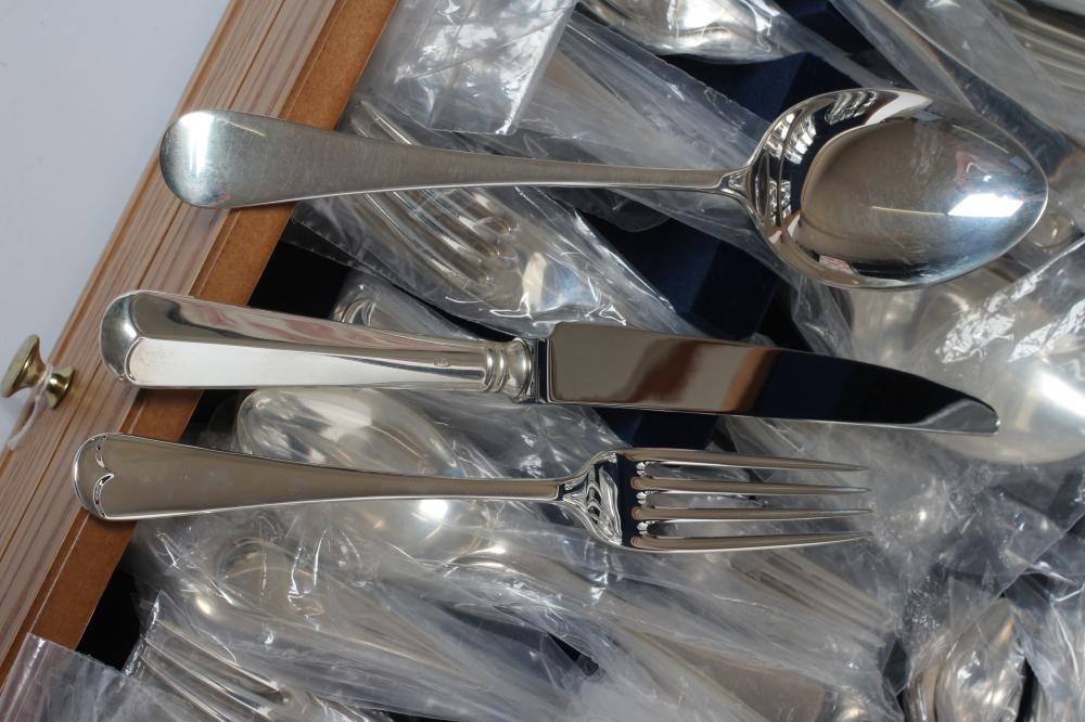 A SILVER TABLE SERVICE FOR EIGHT PLACE SETTINGS Image