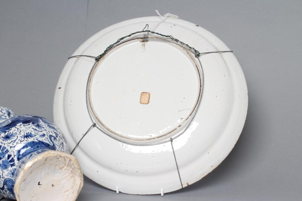 A DUTCH DELFT GARLIC NECK BOTTLE VASE of rounded octagonal form Image