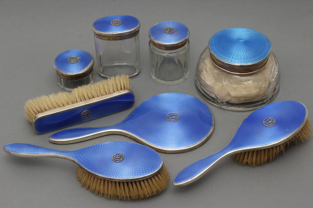 A COMPOSITE ART DECO SEVEN PIECE DRESSING TABLE SET Image