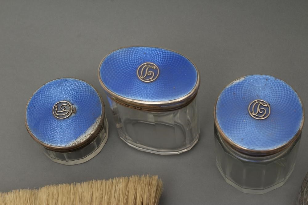 A COMPOSITE ART DECO SEVEN PIECE DRESSING TABLE SET Image