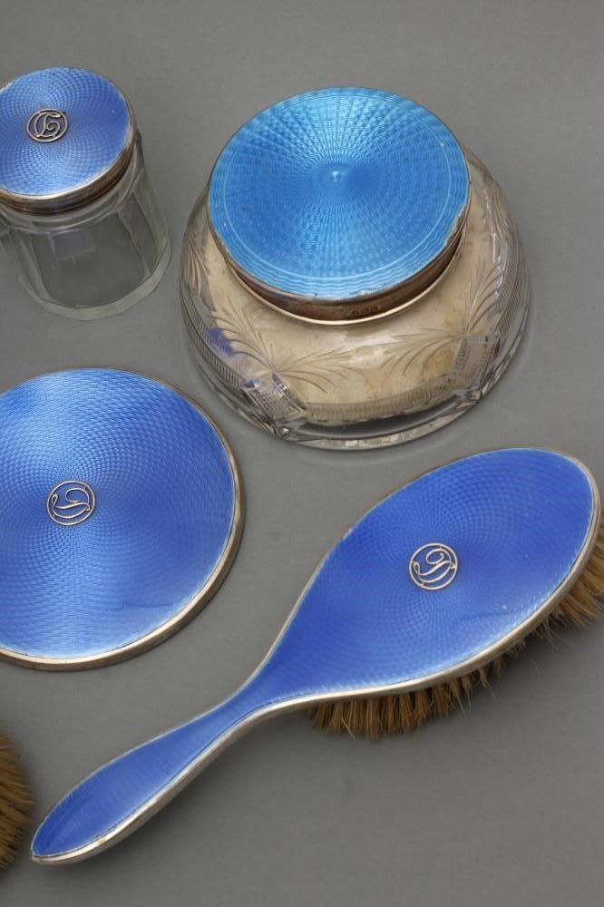 A COMPOSITE ART DECO SEVEN PIECE DRESSING TABLE SET Image