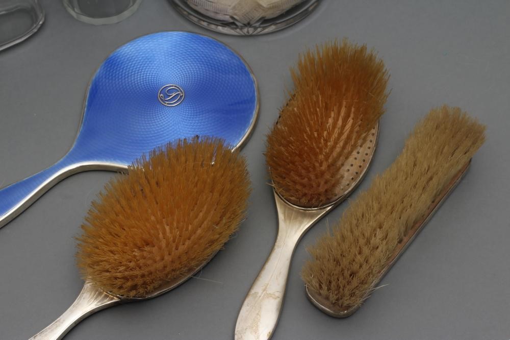 A COMPOSITE ART DECO SEVEN PIECE DRESSING TABLE SET Image