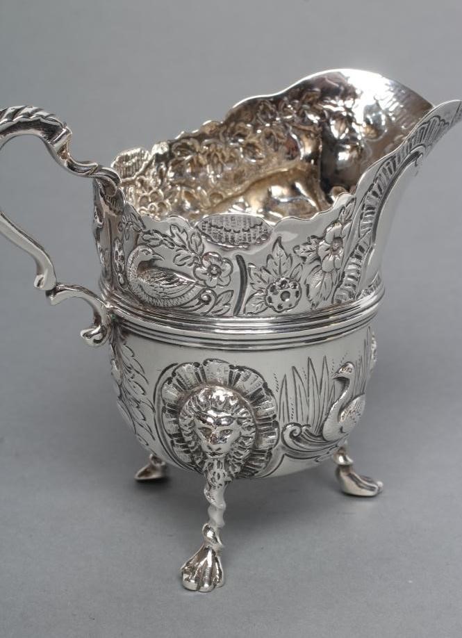 A LATE VICTORIAN SILVER CREAM JUG AND SUGAR BASIN Image