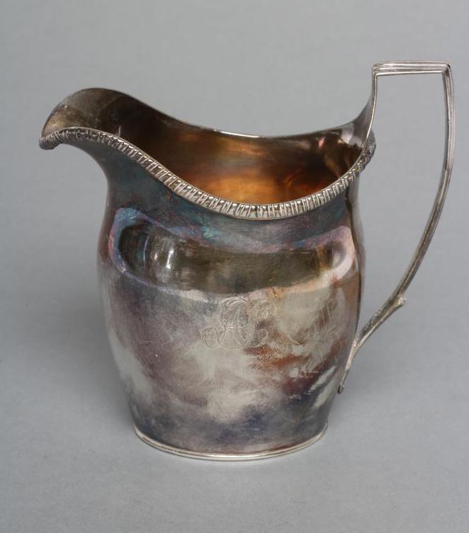 A GEORGE III SILVER MILK JUG Image