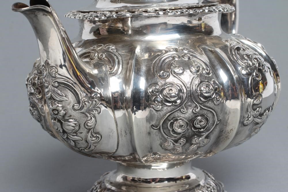 A MID VICTORIAN SILVER TEAPOT Image