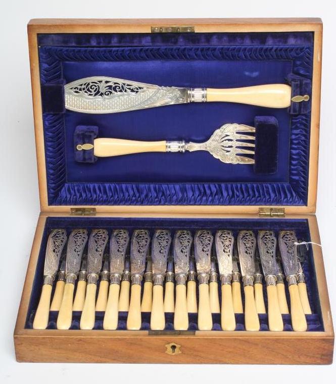 A SET OF TWELVE PAIRS OF EDWARDIAN SILVER FISH KNIVES AND FORKS Image