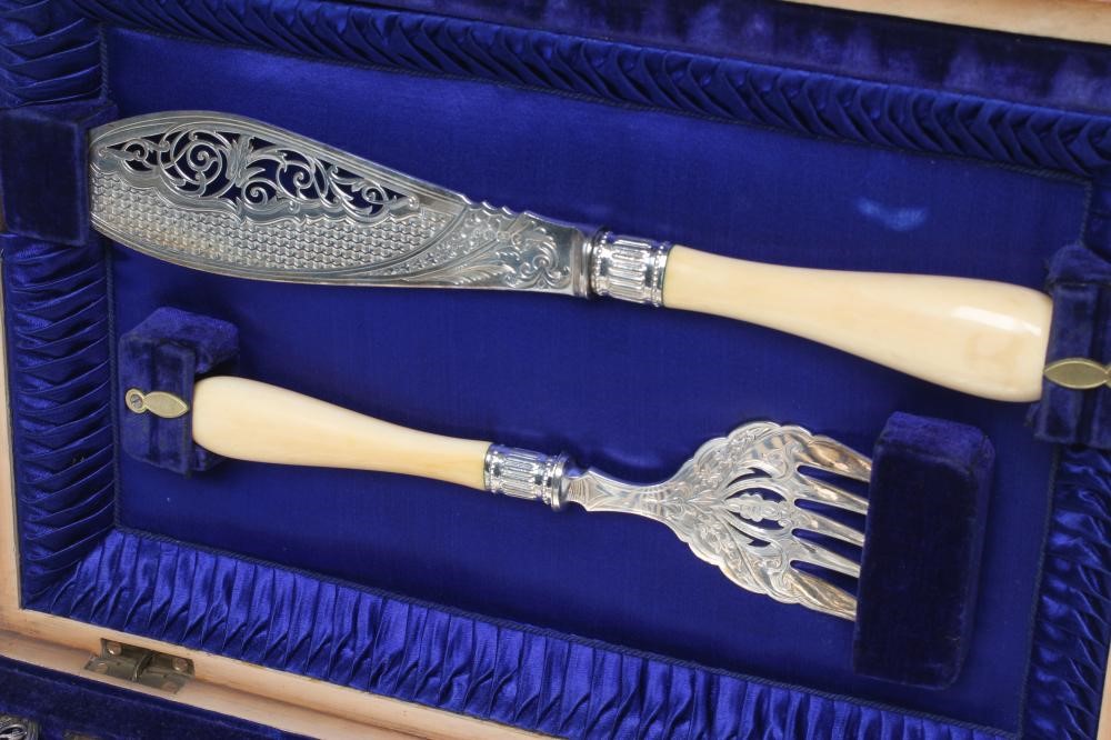 A SET OF TWELVE PAIRS OF EDWARDIAN SILVER FISH KNIVES AND FORKS Image