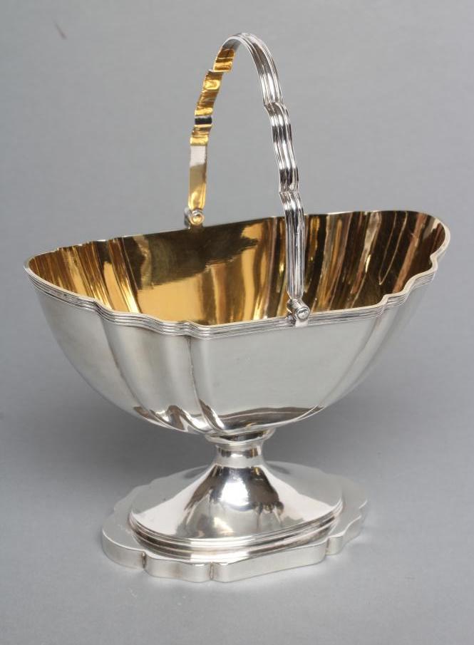 A LATE GEORGE III SILVER SUGAR BASKET Image