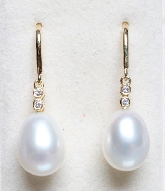 A PAIR OF PEARL AND DIAMOND DROP EARRINGS Image