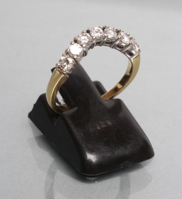 A DIAMOND HALF HOOP WISHBONE ETERNITY RING Image