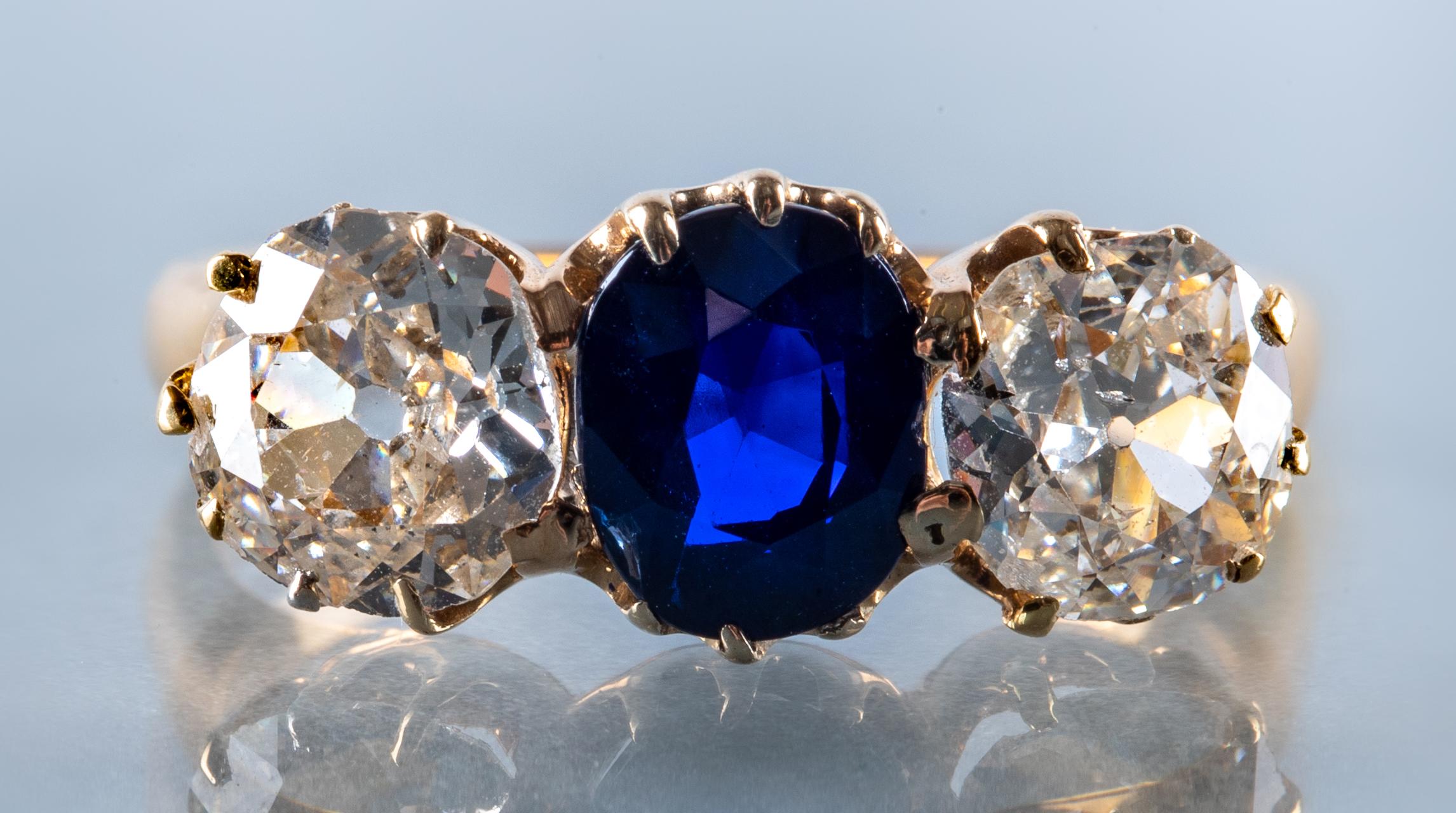 A SAPPHIRE AND DIAMOND THREE STONE RING Image