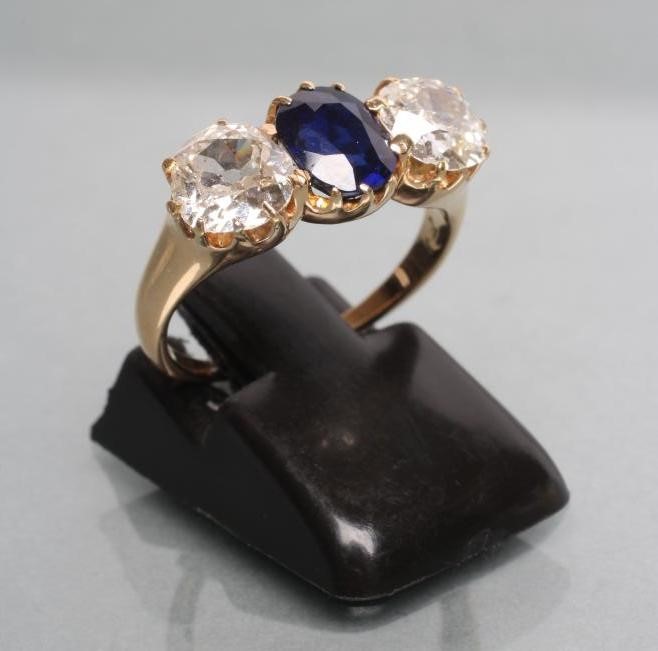 A SAPPHIRE AND DIAMOND THREE STONE RING Image