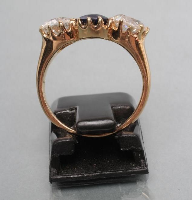 A SAPPHIRE AND DIAMOND THREE STONE RING Image