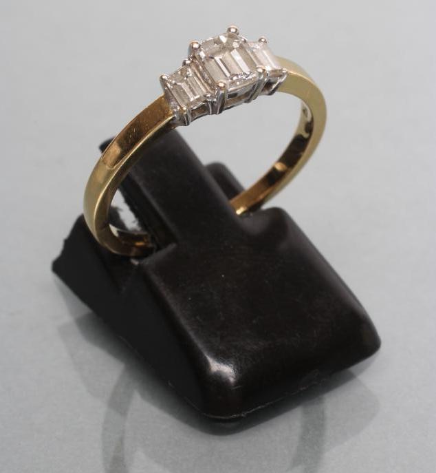 A THREE STONE DIAMOND RING Image