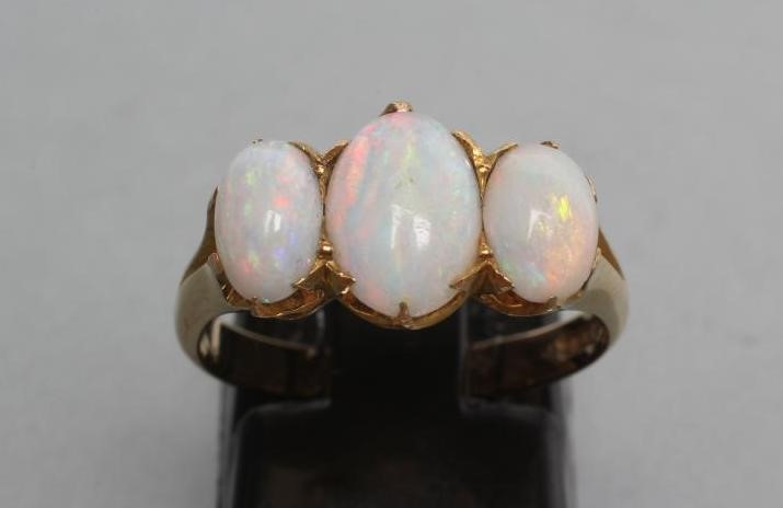 A THREE STONE OPAL RING Image