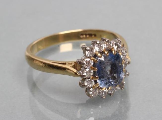 A SAPPHIRE AND DIAMOND CLUSTER RING Image