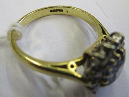 A SAPPHIRE AND DIAMOND CLUSTER RING Image