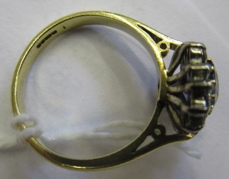 A SAPPHIRE AND DIAMOND CLUSTER RING Image