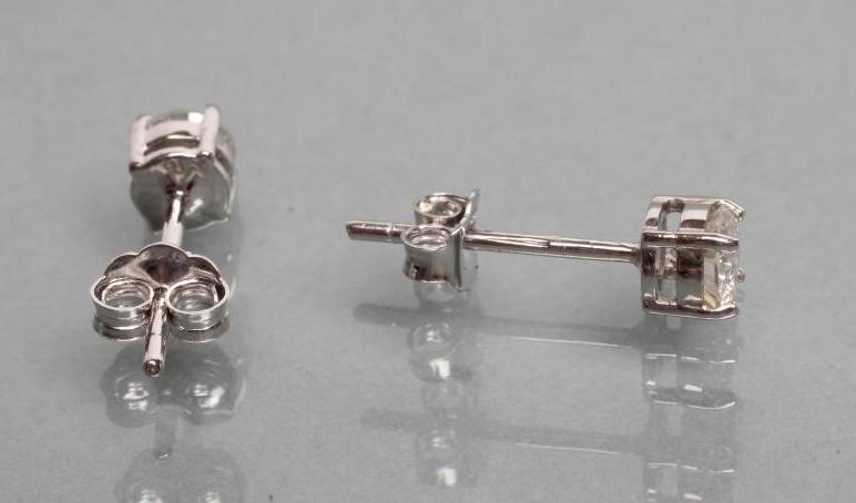 A PAIR OF DIAMOND SOLITAIRE EAR STUDS Image
