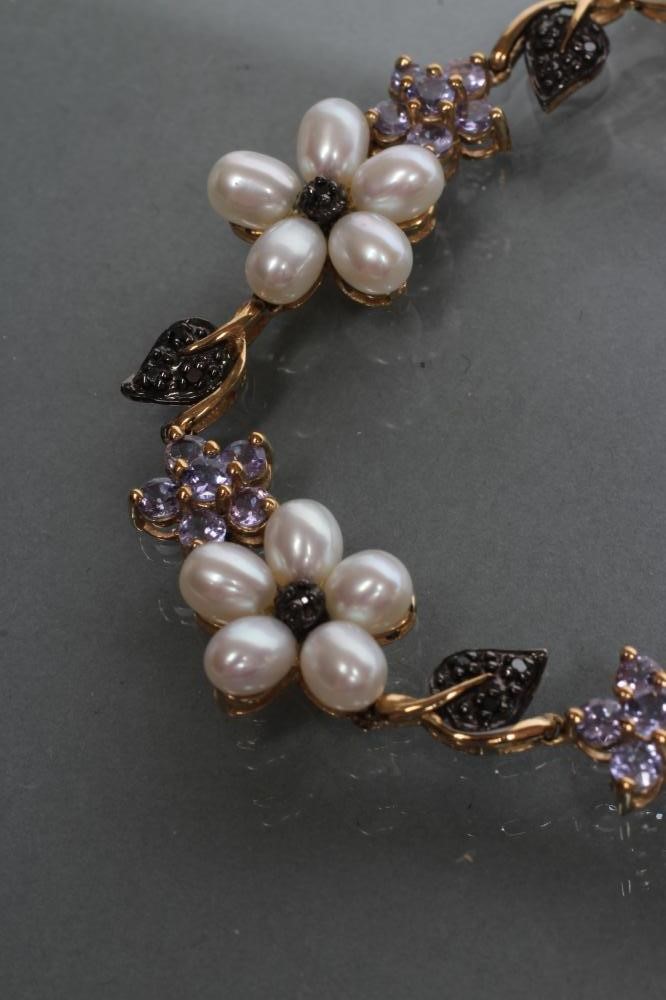 A CULTURED PEARL AND GEM BRACELET Image