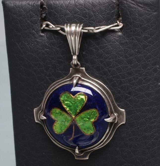 A CONTINENTAL SILVER AND GUILLOCHE ENAMEL CIRCULAR BROOCH Image