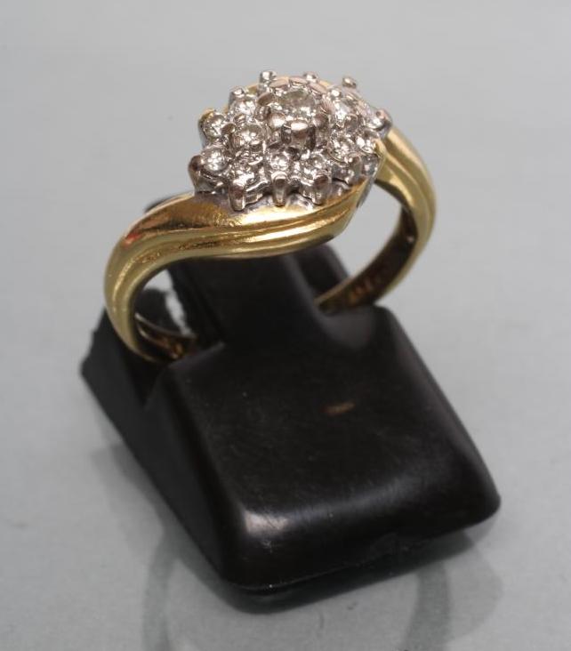 A DIAMOND CLUSTER RING Image