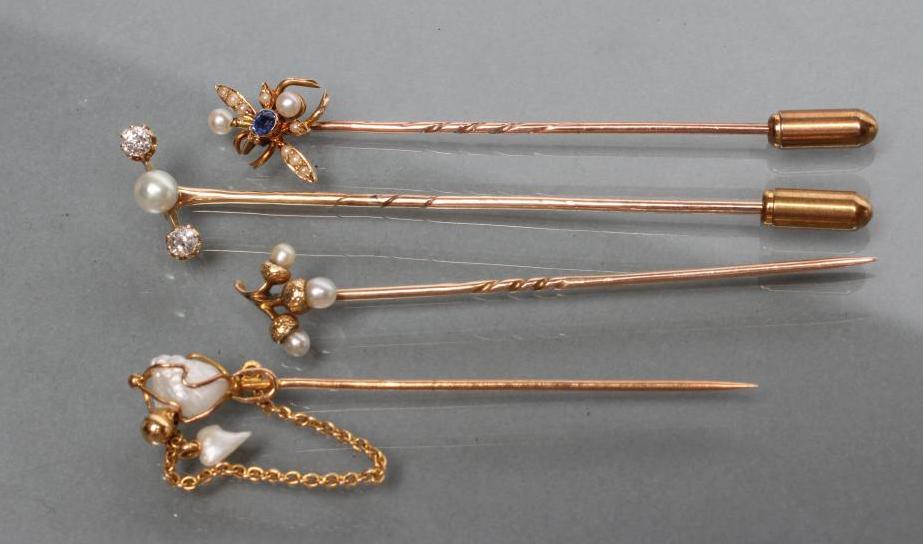 A COLLECTION OF FOUR VICTORIAN AND LATER STICK PINS including a fly with sapphire head and seed Image