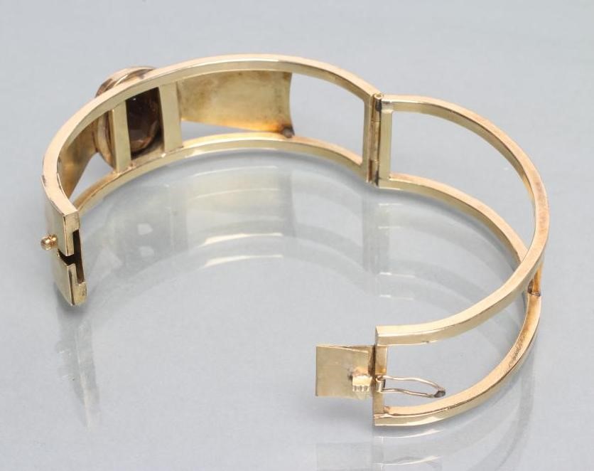 AN AUSTRIAN SMOKEY QUARTZ STIFF HINGED BANGLE Image