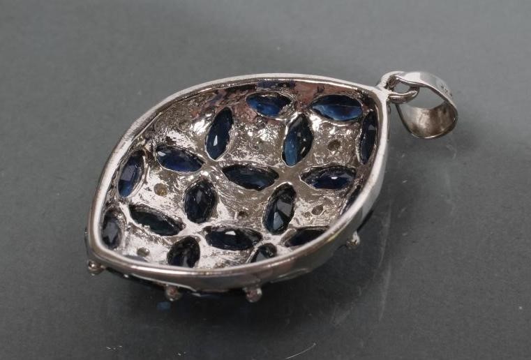 A SAPPHIRE AND DIAMOND PENDANT of eliptical form Image