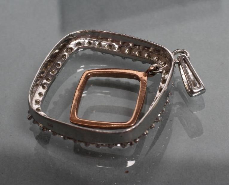 A BI-COLOUR 9CT GOLD PENDANT of open quatrefoil form Image