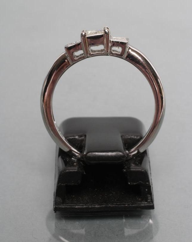 A THREE STONE DIAMOND RING Image