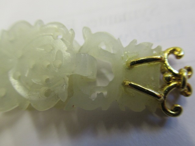 A PAIR OF CHINESE JADE EAR DROPS Image