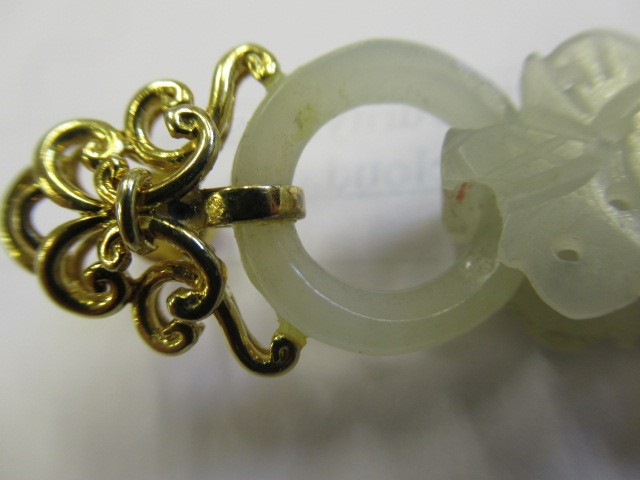 A PAIR OF CHINESE JADE EAR DROPS Image