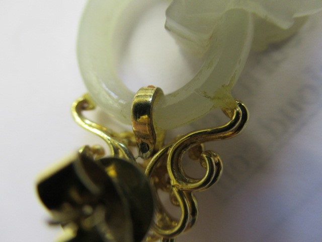 A PAIR OF CHINESE JADE EAR DROPS Image