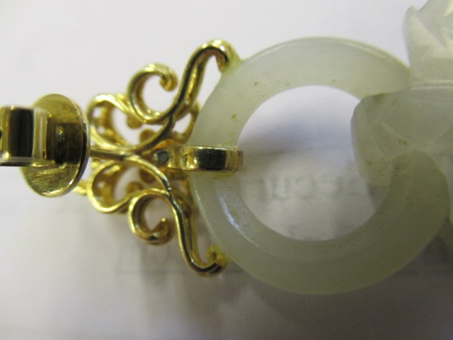 A PAIR OF CHINESE JADE EAR DROPS Image