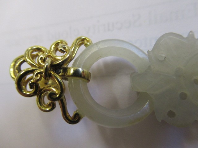 A PAIR OF CHINESE JADE EAR DROPS Image